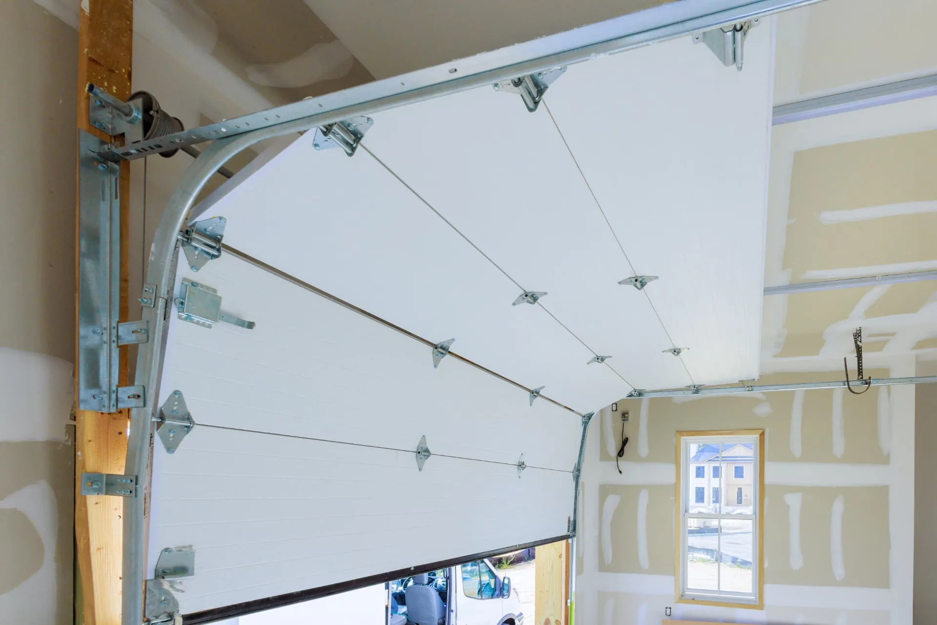 Open sectional garage door interior after a repair visit in Anthem, AZ