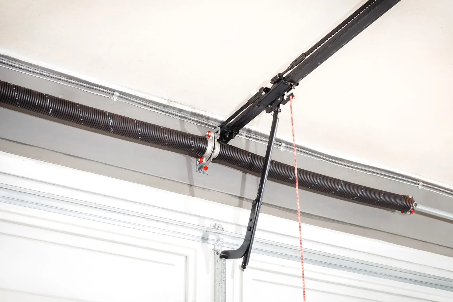 AZ Garage Door Pros technician servicing a residential garage door in New River, AZ