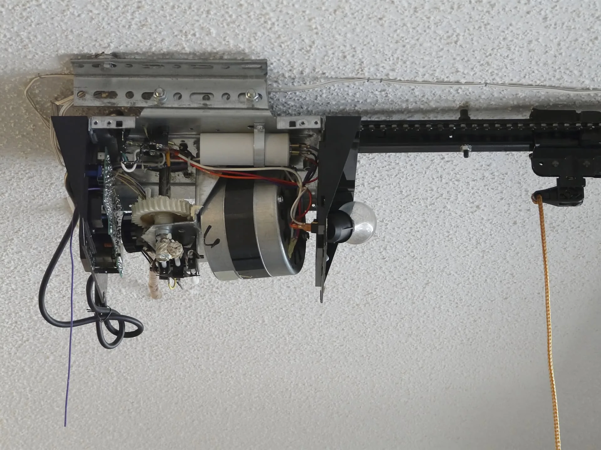 AZ Garage Door Pros technician servicing a residential garage door in Anthem, AZ