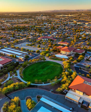 Aerial view of Peoria, Arizona, showcasing residential areas, parks, and commercial buildings, emphasizing the community served by AZ Garage Door Pros LLC for garage door services.